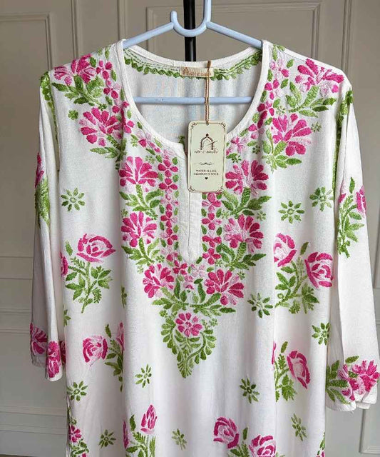 Close-up of shaded pink and green hand Chikankari embroidery on neckline and upper body of Mehram white rayon kurti — Noor-e-Awadh