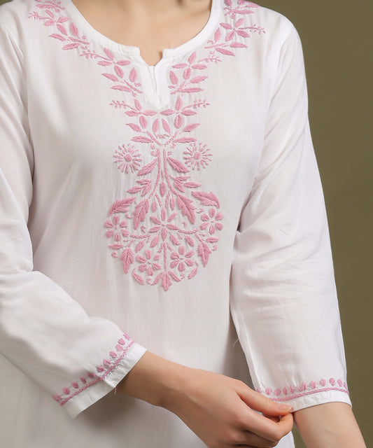 Close-up of pink Ghas Patti chikankari embroidery on white rayon kurta neckline by Noor-e-Awadh NOORI