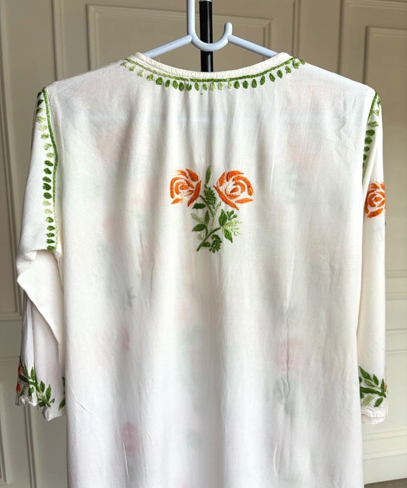 Back view of Mehram Lucknowi Chikankari white rayon kurti showing shaded orange floral Chikankari motif on back panel — Noor-e-Awadh