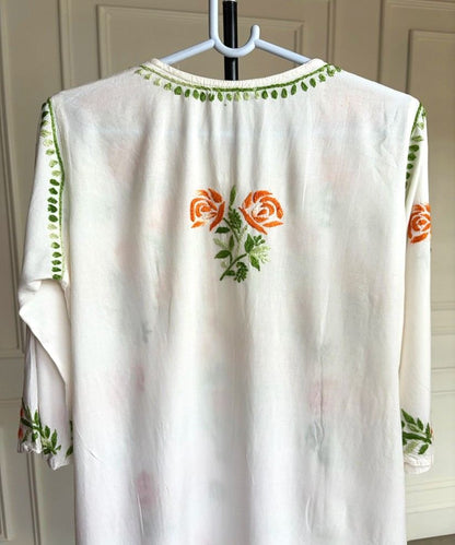 Back view of Mehram Lucknowi Chikankari white rayon kurti showing shaded orange floral Chikankari motif on back panel — Noor-e-Awadh