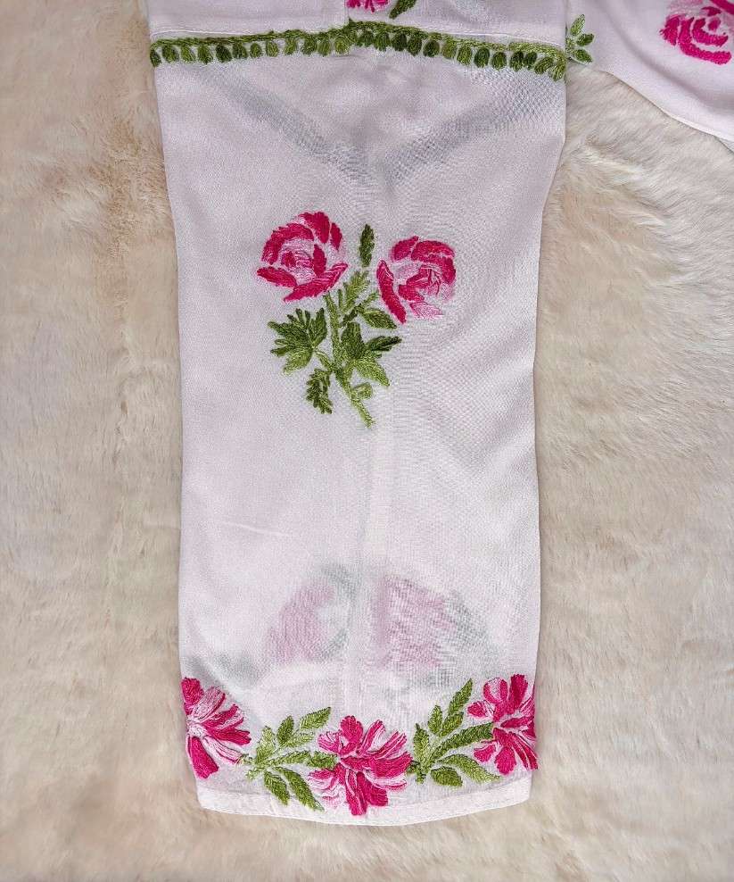 Close-up of shaded pink and green hand Chikankari embroidery on sleeve and cuff of Mehram white rayon kurti — Noor-e-Awadh
