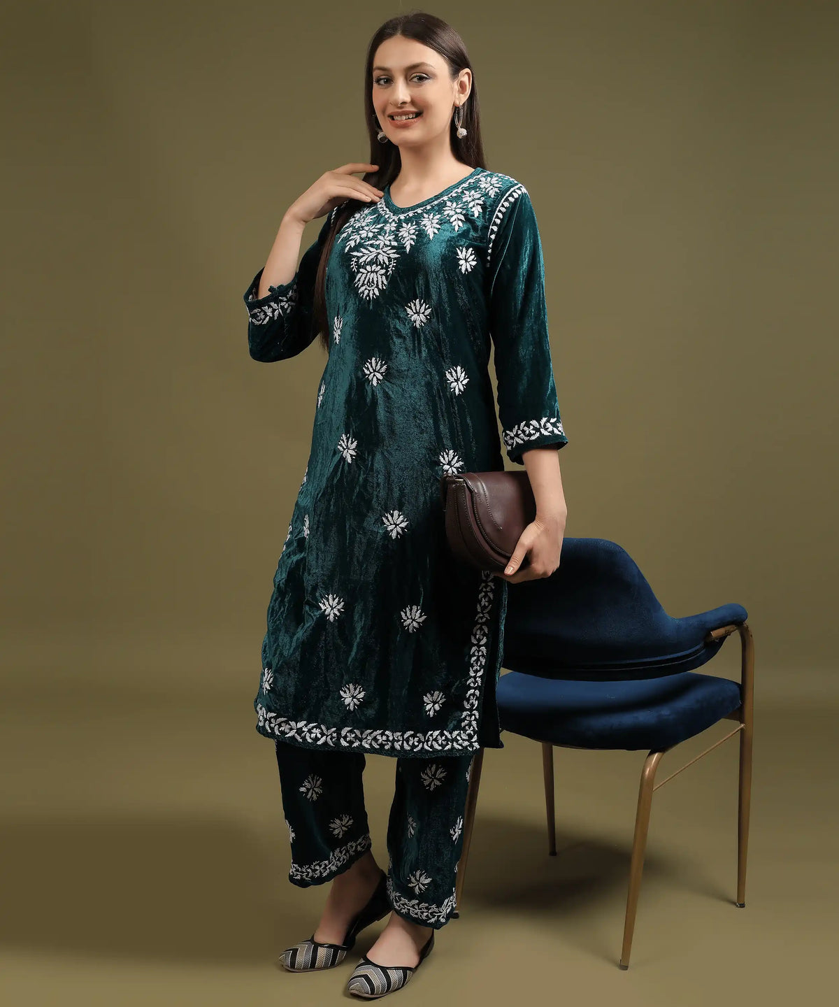 Woman styling Ruh Lucknowi hand embroidered velvet kurta set in bottle green with handbag, festive ethnic look — Noor-e-Awadh